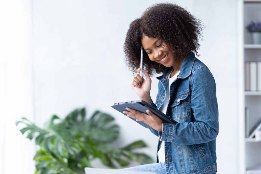 Cheerful African Businesswoman Using Tablet Comput 2023 03 22 10 24 03 Utc Scaled.jpg